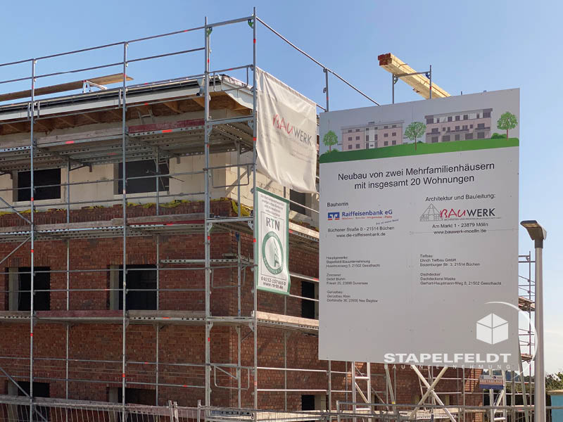 Haus bauen Büchen Pötrau Bauunternehmen Neubau Neubauvorhaben Neubauwohnungen Hausbau Wohnhaus Energieeffizienz KfW55 barrierefreie Wohnungen DIN 18040-1/2 Mehrfamilienhäuser Raiffeisenbank eG Rohbau Großen Sandkamp Stapelfeldt Bauunternehmung