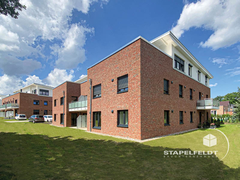 Haus bauen Büchen Pötrau Bauunternehmen Neubau Neubauvorhaben Neubauwohnungen Hausbau Wohnhaus Energieeffizienz KfW55 barrierefreie Wohnungen DIN 18040-1/2 Mehrfamilienhäuser Raiffeisenbank eG Rohbau Großen Sandkamp Stapelfeldt Bauunternehmung