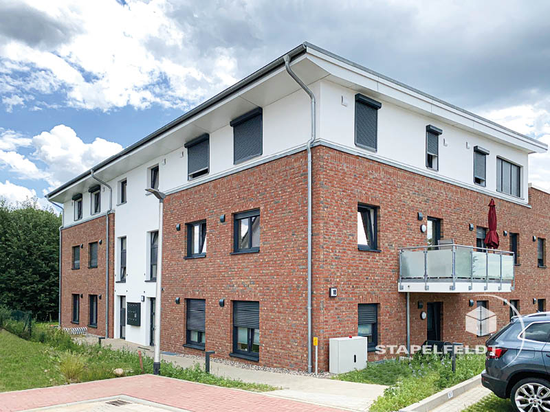 Haus bauen Büchen Pötrau Bauunternehmen Neubau Neubauvorhaben Neubauwohnungen Hausbau Wohnhaus Energieeffizienz KfW55 barrierefreie Wohnungen DIN 18040-1/2 Mehrfamilienhäuser Raiffeisenbank eG Rohbau Großen Sandkamp Stapelfeldt Bauunternehmung