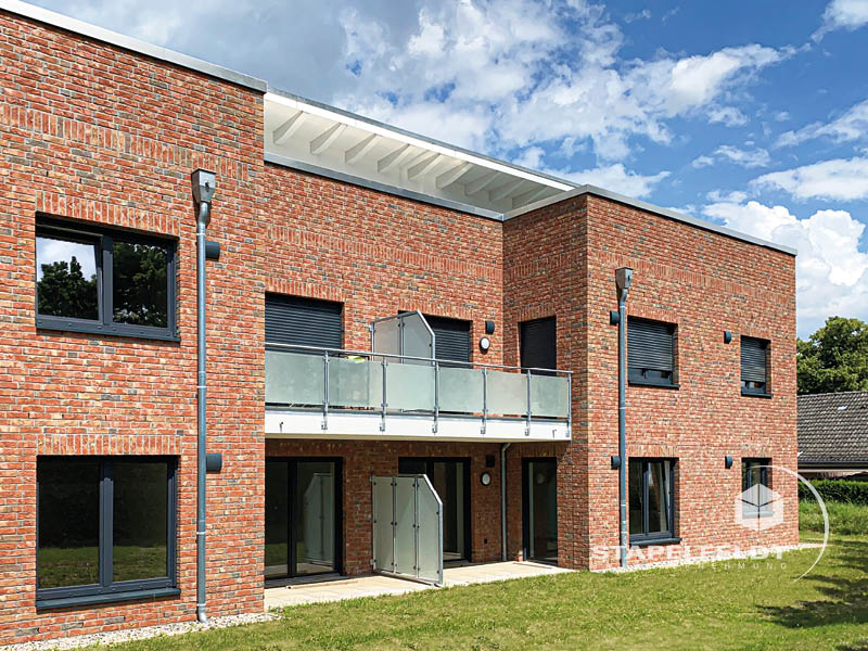 Haus bauen Büchen Pötrau Bauunternehmen Neubau Neubauvorhaben Neubauwohnungen Hausbau Wohnhaus Energieeffizienz KfW55 barrierefreie Wohnungen DIN 18040-1/2 Mehrfamilienhäuser Raiffeisenbank eG Rohbau Großen Sandkamp Stapelfeldt Bauunternehmung