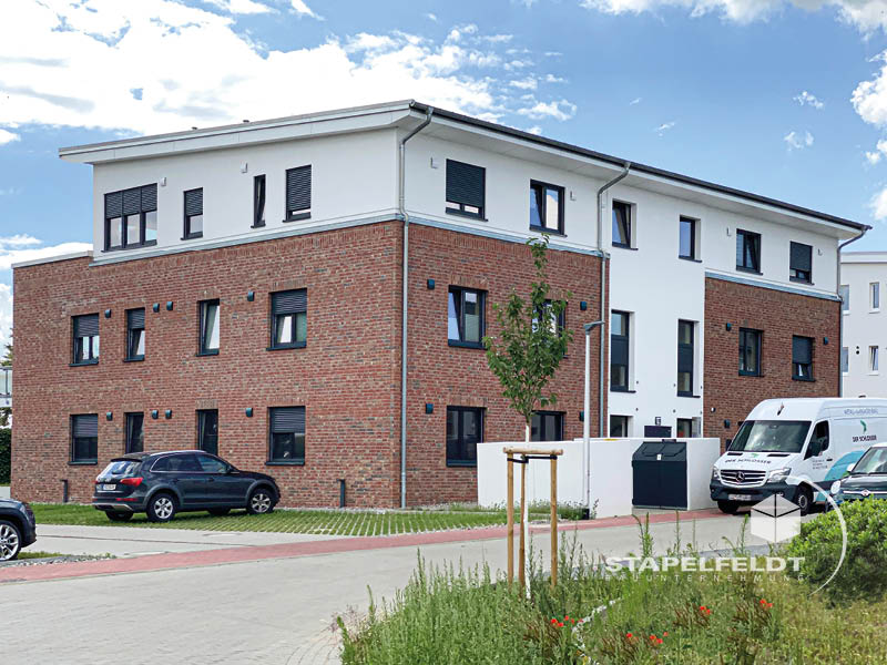 Haus bauen Büchen Pötrau Bauunternehmen Neubau Neubauvorhaben Neubauwohnungen Hausbau Wohnhaus Energieeffizienz KfW55 barrierefreie Wohnungen DIN 18040-1/2 Mehrfamilienhäuser Raiffeisenbank eG Rohbau Großen Sandkamp Stapelfeldt Bauunternehmung